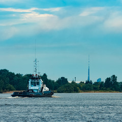 Black tug ship underway