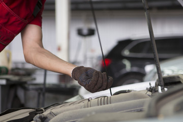 People are repair a car Use a wrench and a screwdriver to work.Safe and confident in driving