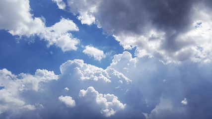 white fluffy clouds in sunny day