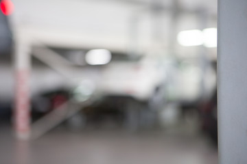 Fototapeta premium Car in garage, auto repair service shop with special repairing equipment