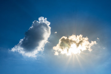 Sun breakthrough clouds and blue sky