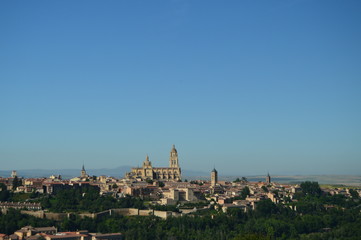 Fototapeta na wymiar Beautiful Panoramic Photo Of The Center Of Segovia With Its Wall And Majestic Cathedral In Segovia. Architecture, Travel, History. June 18, 2018. Segovia Castilla Leon Spain.