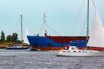 Blue cargo ship underway