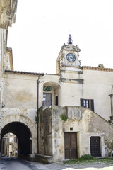 pretty Italian village. In the square stands the old clock