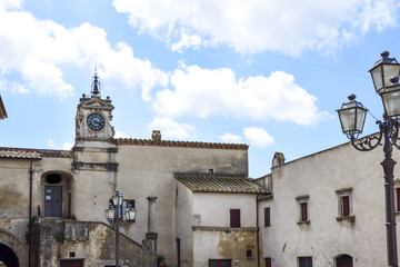 Fototapeta na wymiar pretty Italian village. In the square stands the old clock