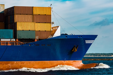 Blue container ship underway