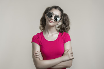 Portrait of a mixed-race teenager girl in sunglasses. 