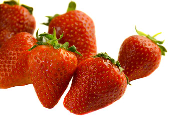 Pile of fresh strawberries isolated on white background
