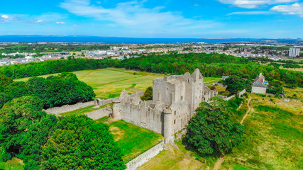 Aerial view over Craigmillar Castle and the city of Edinburgh