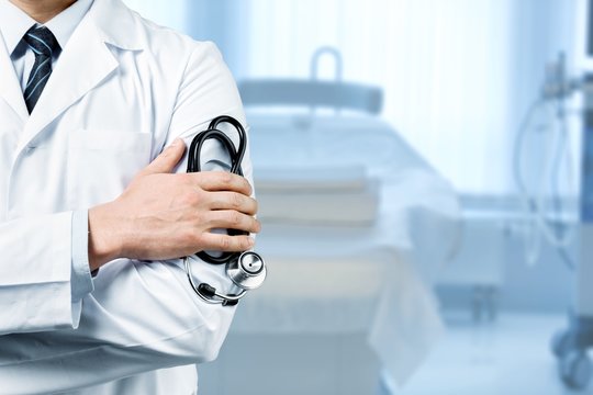 Man doctor holding stethoscope