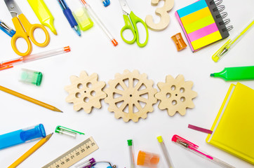 wooden gear on the creative school desk. educational process. mechanism interaction, principle of action. creativity and education system. development of young children. imagination, thinking