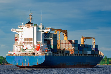 Blue container ship underway