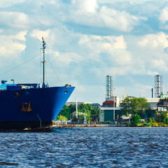 Blue cargo ship underway