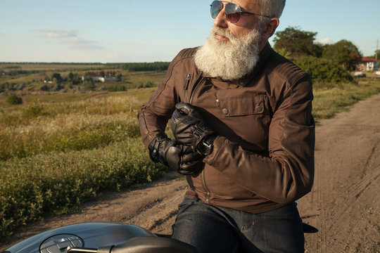 Portrait of a senior man outdoors. Old biker portrait.