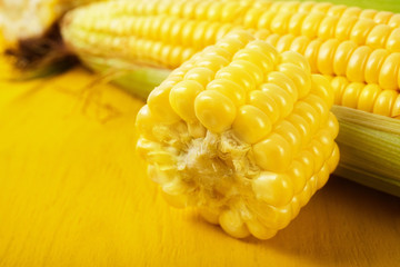 Fresh corn on wood desk
