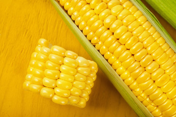 Fresh corn on wood desk