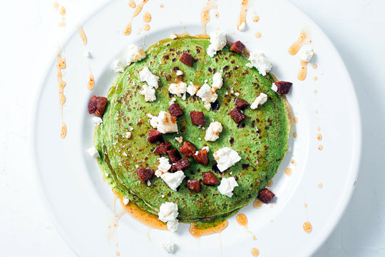 Spinach crepes with chorizo and feta