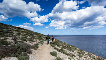 Exploring the beautiful shorelines in Mallorca under a gorgeous cloudy sky.