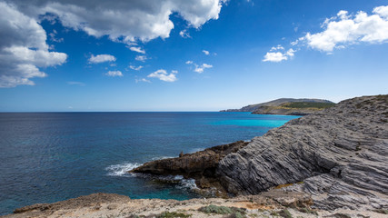 Fototapeta na wymiar The beautiful rugged shoreline of Mallorca island is something worth hiking.