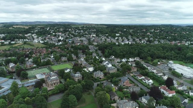 Aerial footage over the village of Kilmacolm in West Central Scotland.
