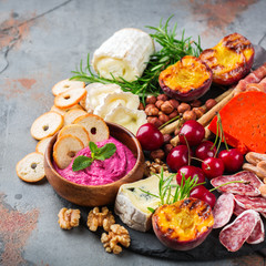 Assortment of spanish tapas or italian antipasti with hummus