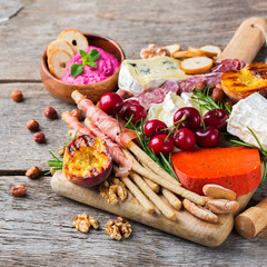 Assortment of spanish tapas or italian antipasti with hummus
