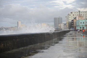 Waves crashing on the charming Malecon promenade of the City of Havana Cuba