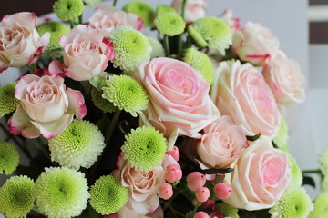 red roses on black background with pearls decoration 