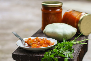 bush pumpkin in tomato sauce (a portion of salad) - conservation of products. food background
