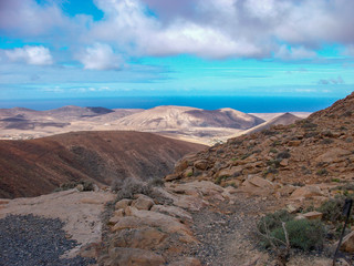 the rocky island fuerteventura with mountains and beach.