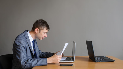 A business man looking at his computer