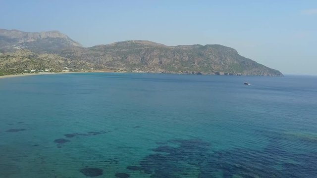 drone flight over the sea and beach of karpathos, greece.