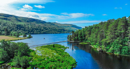 Amazing landscape with creeks and lakes in the Scottish Highlands - romantic aerial view