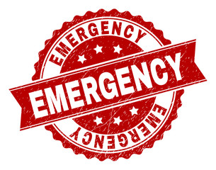 EMERGENCY seal print with corroded texture. Rubber seal imitation has round medal form and contains ribbon. Red vector rubber print of EMERGENCY label with grunge texture.