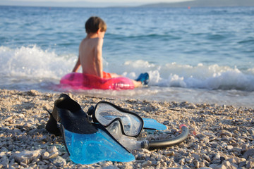 Mask Set and  Snorkel Fin with boy on background