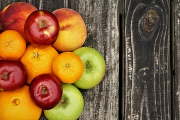 Colorful various kinds of fruit on the old wooden background with space for text, Aumn in GA USA.