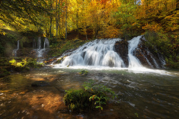 Dokuzak waterfall in Strandja mountain, Bulgaria during autumn. Beautiful view of a river with an waterfall in the forest. Magnificent autumn landscape.