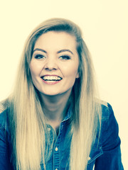 Fototapeta premium Portrait of happy blonde woman smiling with joy