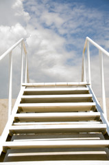 A staircase leading to the sky, skyward, a sunny day