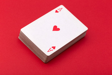 deck of playing cards with an ACE of hearts on top