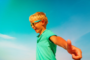 happy little girl smile face at summer sky