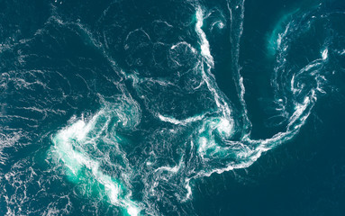Abstract water currents, rapids and whirlpools in fjord. Saltstraumen, Norway - Powered by Adobe