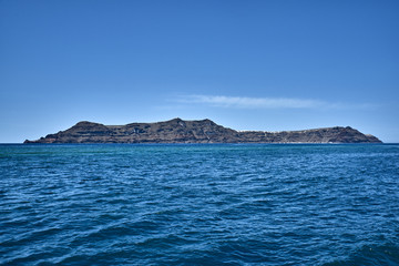 Fototapeta na wymiar Greece. Santorini. The island of Nea Kameni. Panorama of the caldera with the island of Tirasia