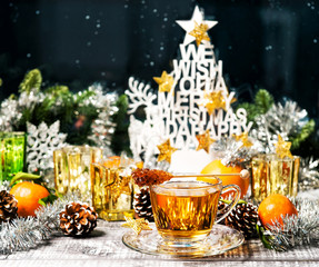 Fototapeta na wymiar Christmas ornaments Hot tea festive window decoration