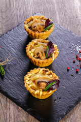 Canape with mushroom and cheese