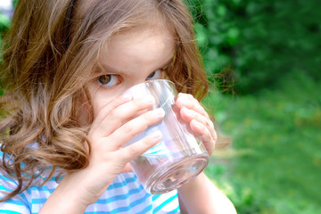 Child drinks water.