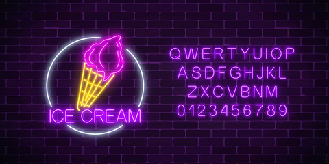 Neon glowing sign of cake with glaze in circle frame with alphabet. Fastfood light billboard symbol.