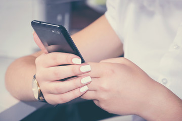 Young woman with modern cellphone