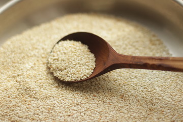 sesame seeds in a wooden spoon