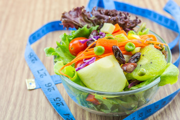 Fresh mixed vegetables salad and measure.